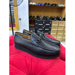 Black perforated leather shoe