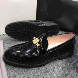 Glossy black studded loafers
