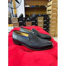 Black leather penny loafers