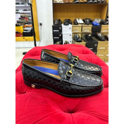 Black leather horsebit loafers